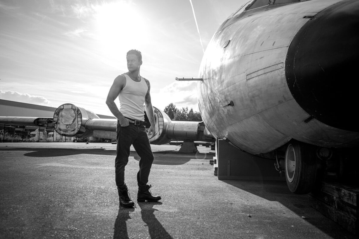 Gary Lucy, editorial portrait, aircraft fuselage backdrop