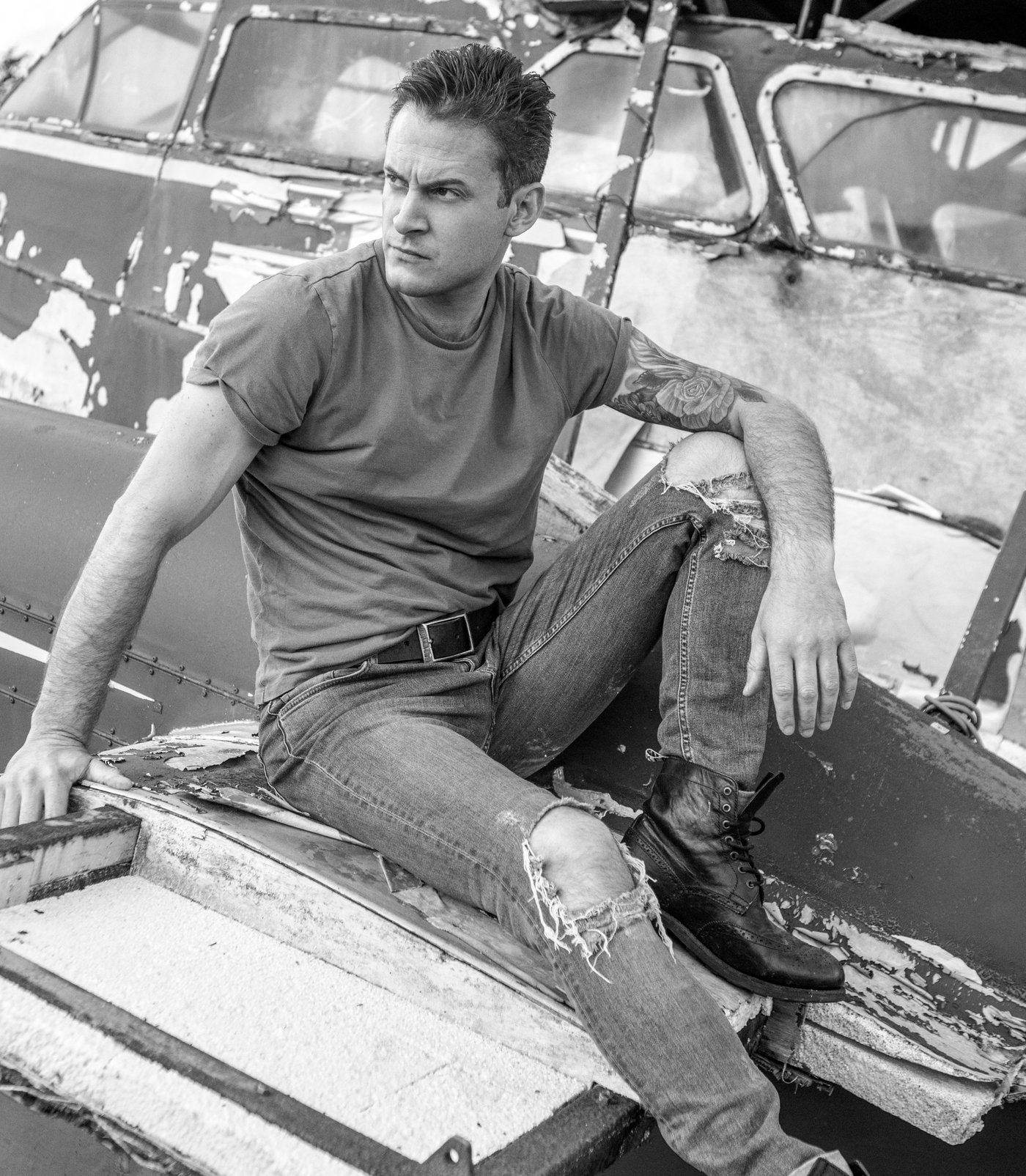 Gary Lucy, editorial portrait, seated